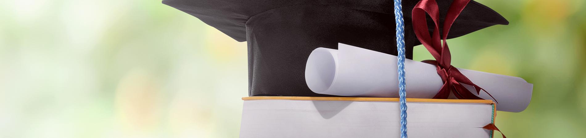 Graduation hat and diploma